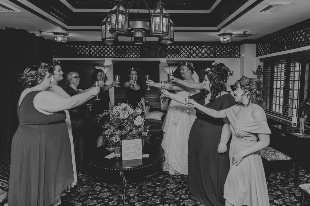 champagne toast with bridesmaids